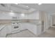 White kitchen boasts ample storage and a large workspace at 3719 Colonial Dr, Las Vegas, NV 89121