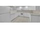 White kitchen features, ample counter space, and tile floors at 3719 Colonial Dr, Las Vegas, NV 89121