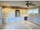 Living room with built-in white cabinets and tile flooring at 3719 Colonial Dr, Las Vegas, NV 89121