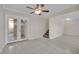 Living room with tile floors, double doors, and staircase at 3719 Colonial Dr, Las Vegas, NV 89121