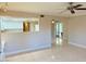 Bright living room with tile floors and a view into the kitchen at 3719 Colonial Dr, Las Vegas, NV 89121