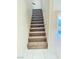 Carpeted staircase with wood railing at 3719 Colonial Dr, Las Vegas, NV 89121