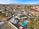 Aerial view showing single-story home with pool, solar panels, and surrounding neighborhood at 4767 Del Sueno Dr, Las Vegas, NV 89120