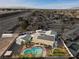 Aerial view of single story home with pool and solar panels, nestled in a quiet neighborhood at 4767 Del Sueno Dr, Las Vegas, NV 89120