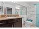 Bathroom with dark vanity, shower/tub combo, and granite countertop at 4767 Del Sueno Dr, Las Vegas, NV 89120