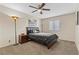 Well-lit bedroom with a queen-size bed and ceiling fan at 4767 Del Sueno Dr, Las Vegas, NV 89120