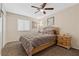 Bright bedroom with a queen bed, ceiling fan, and ample closet space at 4767 Del Sueno Dr, Las Vegas, NV 89120