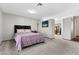 Large bedroom with a queen bed and walk-in closet at 4767 Del Sueno Dr, Las Vegas, NV 89120