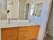 Double vanity bathroom with wood cabinets and a bathtub at 5455 Hasley Canyon Ave, Las Vegas, NV 89139