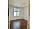 Spacious bedroom with wood floors and large window at 5455 Hasley Canyon Ave, Las Vegas, NV 89139