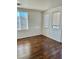 Well-lit bedroom featuring wood flooring and windows at 5455 Hasley Canyon Ave, Las Vegas, NV 89139