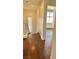 Light-filled hallway with wood flooring and access to other rooms at 5455 Hasley Canyon Ave, Las Vegas, NV 89139