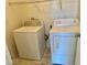 Laundry room with washer and dryer, and overhead shelving at 5455 Hasley Canyon Ave, Las Vegas, NV 89139