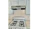 White stove top with overhead microwave at 5455 Hasley Canyon Ave, Las Vegas, NV 89139