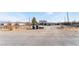 House with a large yard and desert landscape in the background at 664 Spring Rd, Indian Springs, NV 89018