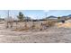 House with a large yard and desert landscape in the background at 664 Spring Rd, Indian Springs, NV 89018