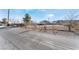 House with a large yard and desert landscape in the background at 664 Spring Rd, Indian Springs, NV 89018