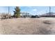 House with a large yard and desert landscape in the background at 664 Spring Rd, Indian Springs, NV 89018