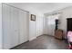 Bright bedroom with double doors and wood flooring at 664 Spring Rd, Indian Springs, NV 89018