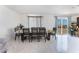 Dining room with sunflower tablecloth and sliding glass door to patio at 664 Spring Rd, Indian Springs, NV 89018