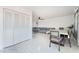 Dining area with table and chairs adjacent to living room at 664 Spring Rd, Indian Springs, NV 89018