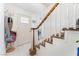 Bright entryway with staircase, coat rack, and tile flooring at 664 Spring Rd, Indian Springs, NV 89018