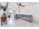 Living room with gray sectional sofa and ceiling fan at 664 Spring Rd, Indian Springs, NV 89018