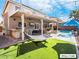 Inviting backyard with a pool, hammock, and built-in grill at 9637 Lions Peak Ct, Las Vegas, NV 89139