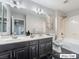 Double vanity bathroom with a soaking tub and shower at 9637 Lions Peak Ct, Las Vegas, NV 89139