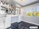 Modern bathroom with double vanity and black marble floors at 9637 Lions Peak Ct, Las Vegas, NV 89139