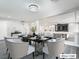 Bright dining room with a table for six, overlooking living room at 9637 Lions Peak Ct, Las Vegas, NV 89139