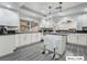 Modern kitchen with white cabinets, kitchen island and dark countertops at 9637 Lions Peak Ct, Las Vegas, NV 89139