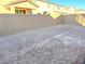 Large, empty backyard with block wall and potential for landscaping at 9922 Angel Valley Dr, Las Vegas, NV 89178