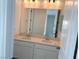 Double vanity bathroom with large mirror at 9922 Angel Valley Dr, Las Vegas, NV 89178