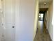 Bright hallway with tile flooring and doors to other rooms at 9922 Angel Valley Dr, Las Vegas, NV 89178