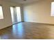 Spacious living room with tile flooring and sliding glass doors leading to the patio at 9922 Angel Valley Dr, Las Vegas, NV 89178