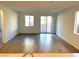 Spacious living room with tile flooring and sliding glass doors at 9922 Angel Valley Dr, Las Vegas, NV 89178