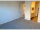 Main bedroom with grey carpet and ensuite bathroom access at 9922 Angel Valley Dr, Las Vegas, NV 89178