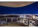 Balcony view showcasing the dazzling lights of Las Vegas at night with a clear, curved railing at 222 Karen Ave # 3907, Las Vegas, NV 89109