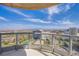 Enjoy panoramic city and mountain views from this spacious balcony with glass railings at 222 Karen Ave # 3907, Las Vegas, NV 89109