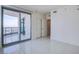 Bright, contemporary bedroom with tile floors and balcony access, offering stunning city views at 222 Karen Ave # 3907, Las Vegas, NV 89109