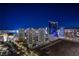 Elevated view of the Las Vegas cityscape at night featuring illuminated buildings and bustling streets at 222 Karen Ave # 3907, Las Vegas, NV 89109