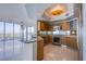 Well-lit kitchen with stainless steel appliances, granite countertops, and a view of the city skyline at 222 Karen Ave # 3907, Las Vegas, NV 89109