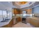 Modern kitchen featuring stainless steel appliances, granite countertops and city views at 222 Karen Ave # 3907, Las Vegas, NV 89109