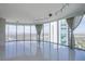 Living room with floor-to-ceiling windows boasts city views and modern lighting at 222 Karen Ave # 3907, Las Vegas, NV 89109