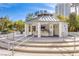 Poolside covered bar area with seating and countertop, next to stairs and buildings at 222 Karen Ave # 3907, Las Vegas, NV 89109