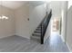 Bright entryway showcasing the staircase and contemporary flooring at 3026 Coveri Ct, Las Vegas, NV 89141