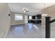 Spacious living area with modern floors leading to the kitchen at 3026 Coveri Ct, Las Vegas, NV 89141