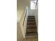 Indoor staircase with carpeting and neutral-colored walls at 505 Crony Ave, Henderson, NV 89011