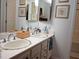 Double vanity bathroom with mosaic tile accents at 6808 Indian Chief Dr # 204, Las Vegas, NV 89130